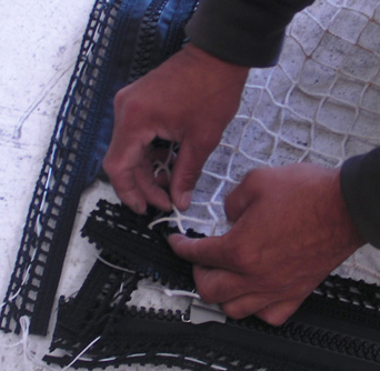 This photo shows how to apply the net to the zipper.